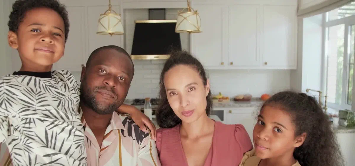 A family in their new home after moving